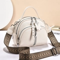 Beige faux leather crossbody bag with wide bohemian strap and textured lychee pattern - White