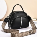 Black pebbled leather crossbody bag with three zipper compartments and woven strap - Black