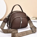 Detail of dark brown litchi textured leather handbag with triple zipper compartments - Coffee
