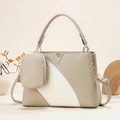 Close-up of contrast color tote bag with litchi texture and golden V hardware detail - Khaki