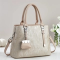 Elegant textured tote bag with top handle and micro handbag charm for women - Apricot