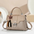 Latte khaki handbag with striped texture, leather flap and star pendant accessory - Khaki