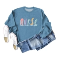 Flat lay of blue nurse-themed sweatshirt with coffee scrubs print and denim pants - Blue (White Print)
