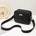Modern black quilted crossbody camera bag with gold hardware and wide woven strap - Black