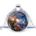Macro shot of silver galaxy pendant necklace with nebula pattern under glass dome - Deep Nebula (JY001051-9)
