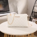 White quilted faux leather crossbody bag with golden chain and metallic logo accent - White