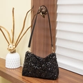 Minimalist black sequin baguette bag with long shoulder strap and golden buckle - Black