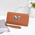 Brown leather clutch wallet featuring a silver liquid metal butterfly and wristlet strap - Brown