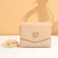 Chic beige short wallet for women featuring a gold-edged heart clasp and plush pompom charm - Apricot