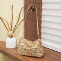 Chic baguette bag in gold sequins featuring a slim beige shoulder strap for women - Gold