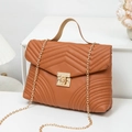 Caramel quilted faux leather crossbody bag with wave pattern and golden chain strap - Brown