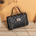 Elegant black quilted crossbody bag with golden chain and metallic twist lock hardware - Black