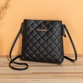 Classic black quilted crossbody bag with gold logo detail and slim shoulder strap - Black