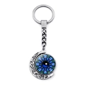 Detail of Eye of Horus moon keychain featuring rotating blue eye and mandala hollow patterns - Ethnic Mandala Eye (JY008520-9)