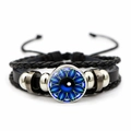 Detailed close-up of woven leather Eye of Horus bracelet with adjustable cord - Dark Blue Floral Eye Style (JY008519-7)