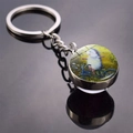 Double-sided glass ball keychain featuring a cute hedgehog riding a bike illustration - Bicycle Riding Style (JY008498-12)