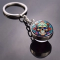 Macro shot of Halloween skull glass dome keychain with colorful mandala patterns - Mandala Skull Art Style (JY008512-9)