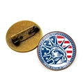 Detailed view of vintage Statue of Liberty brooch with USA flag and pin back mechanism - Close-up Flag Liberty (UNITED STATES OF AMERICA) / Bronze