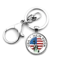 Detail of metal keychain with Statue of Liberty and USA flag charm on white background - USA New York Tourism Souvenir Style (JY008537-10)