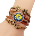 Detail of vintage multilayer leather bracelet with bronze charms and custom round logo glass - Immigration Consultant Logo Motif (JY008529-12)