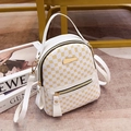 Minimalist white mini backpack with yellow floral pattern and golden hardware features - White