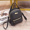 Mini faux leather backpack with circular pattern and gold zippers in dark grey finish - Black