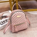 Pink mini faux leather backpack with floral patterns and gold metal brand plate - Pink