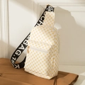 White crossbody chest bag with yellow geometric patterns and wide black letter strap - White