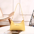 Bright yellow crocodile pattern shoulder bag with silver logo in minimalist setting - Yellow