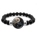 Macro detail of elastic beaded bracelet featuring artistic Yin Yang pendant and dark beads - Art Cloud Pattern Yin Yang (JY008565-9)