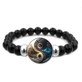 Black beaded Yin Yang bracelet with sun and moon charm on a white background - Sun Moon Mountain Yin Yang (JY008565-8)