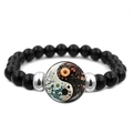 Detail of beaded elastic bracelet featuring black beads and Yin Yang floral glass charm - Floral Fusion Yin Yang (JY008565-7)