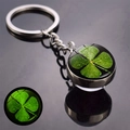 Close-up of luminous four-leaf clover glass ball keychain with glowing green night effect - Luminous Four-Leaf Clover Waterdrop Style (JY008582-6)
