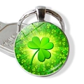 Detailed view of lucky four-leaf clover glass gem pendant on silver metal keychain - Radiating Light Clover Style (JY008583-5)