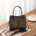 Detailed view of vintage monogram handbag on wooden table with lifestyle coffee props - Coffee Pattern