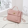 Pink crocodile-embossed mini shoulder bag with gold twist lock and elegant top handle - Pink