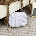 White quilted crossbody bag with V-shaped stitching and golden chain strap for women - White