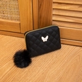 Elegant black quilted leather wallet featuring a butterfly clasp and fuzzy pompom keychain - Black