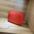 Red quilted leather crossbody camera bag with golden chain strap and V-stitch design - Red