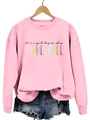 Detailed view of pink pickleball sweatshirt with graphic text on a wooden hanger - S / Pink Sweatshirt (Black Text Pattern)