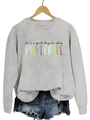Close-up of the colorful 'it's a good day to play pickleball' print on a gray sweatshirt - S / Grey Sweatshirt (Black Text Pattern)