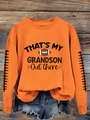 Détail de l'imprimé football et du lettrage blanc sur un sweat-shirt orange vif - S / Orange