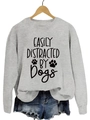Light gray crewneck sweatshirt with black Easily Distracted by Dogs print and paw icons - Grey Sweatshirt (Black Font)