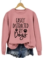Dusty rose crewneck sweatshirt featuring black Easily Distracted by Dogs print and paw motifs - Rose Gold Sweatshirt (Black Font)