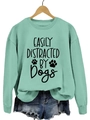 Mint green pullover sweatshirt with black Dogs print on a wooden hanger - Light Green Sweatshirt (Black Font)