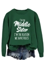 Detail view of dark green sweatshirt with I'm the Middle Sister white letter print - Dark Green (White Font)