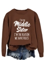 Detail of coffee brown sweatshirt with white text I'm the Middle Sister I'm the Reason We Have Rules - Coffee (White Font)
