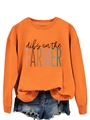 Flat lay of orange crewneck sweatshirt with Dibs on the Farmer text and denim shorts - S / Orange (Black Print)