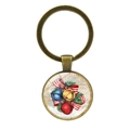 Dettaglio del portachiavi in bronzo con ciondolo in vetro cartolina vintage - Stile Fiocco con Campanello Bronzo