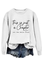 Close-up of 'This is just a Chapter' print on white loose-fit long-sleeve sweatshirt - S / Black Font / White